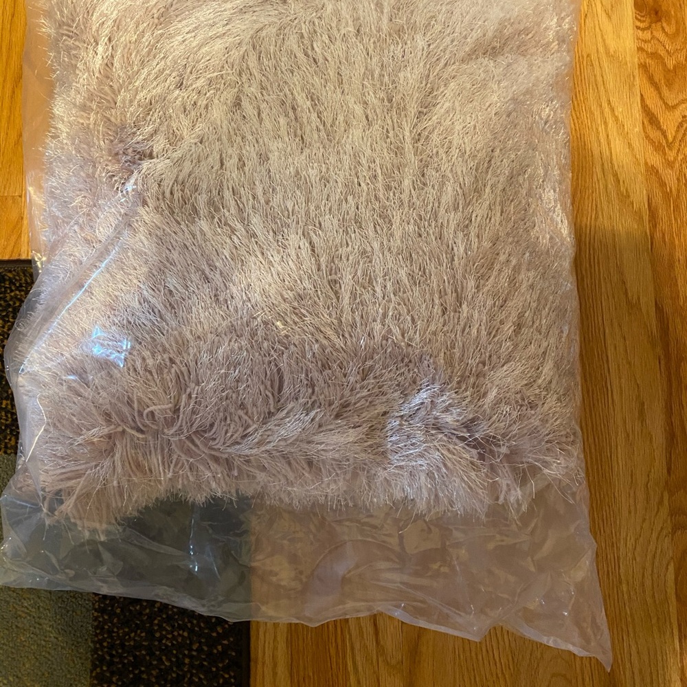 Rose colored throw pillow